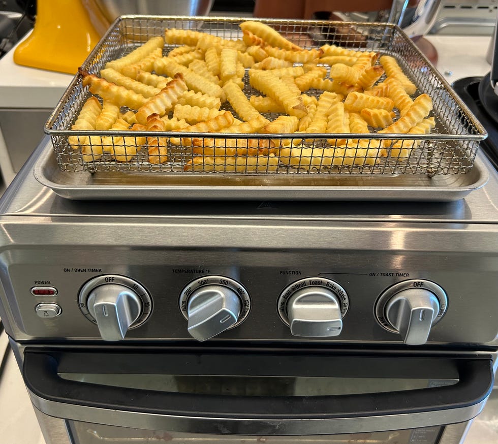 a tray of french fries on a stove