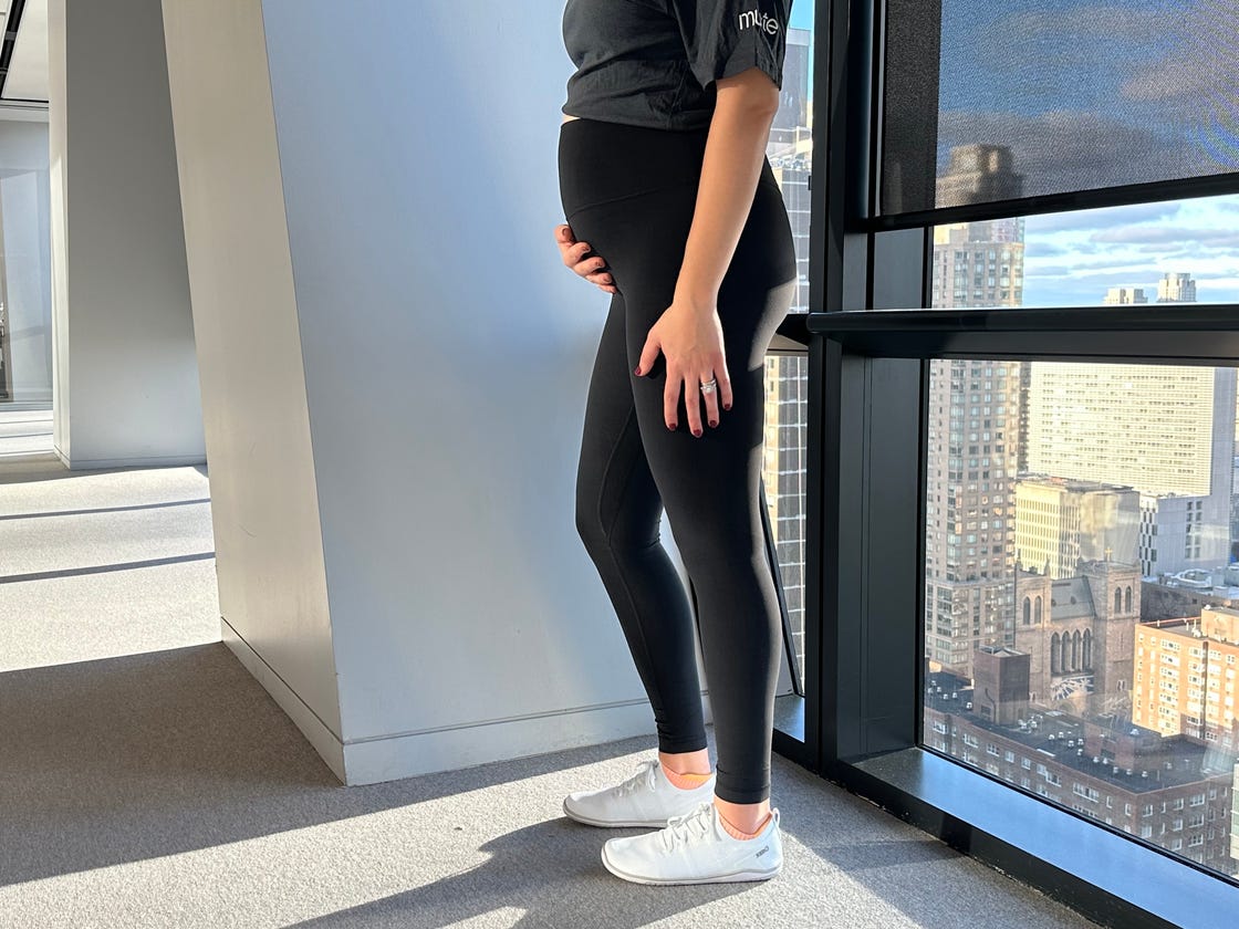 a pregnant person wearing lululemon align pants as maternity leggings