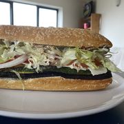 vegetarian italian sub filled with eggplant, zucchini, peppers and olives
