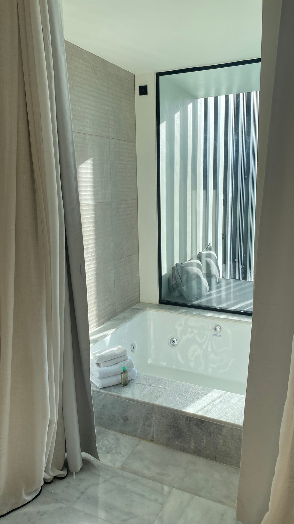 a bathroom with bathtub and shower curtain