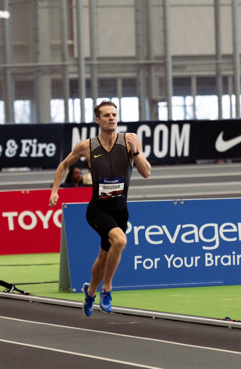 athlete competing in a race on an indoor track