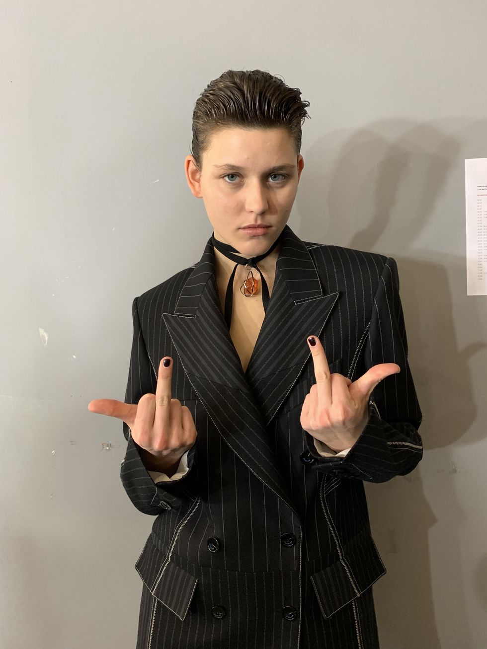 Suit, Hairstyle, Forehead, Finger, Fashion, Formal wear, Cool, Tuxedo, Gesture, Model, 