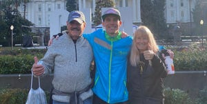 riley cook after the california international marathon with his parents