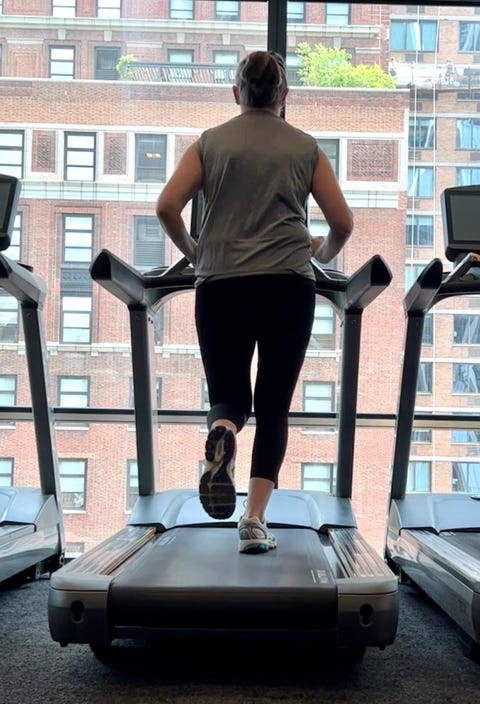 best sports bras for running - testing image a tester running on the treadmill, good housekeeping's testing for best sports bras for running