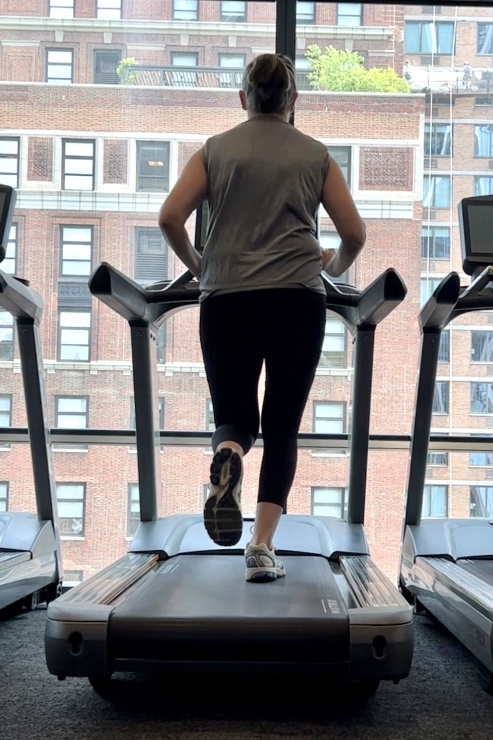 a model running on a treadmill in black lululemon fast and free leggings, good housekeeping's best lululemon leggings testing
