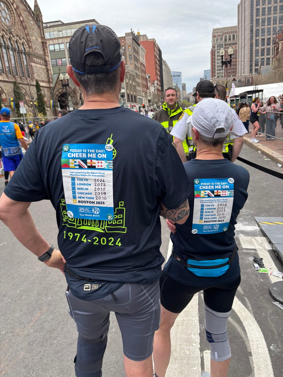 two runners pose from behind