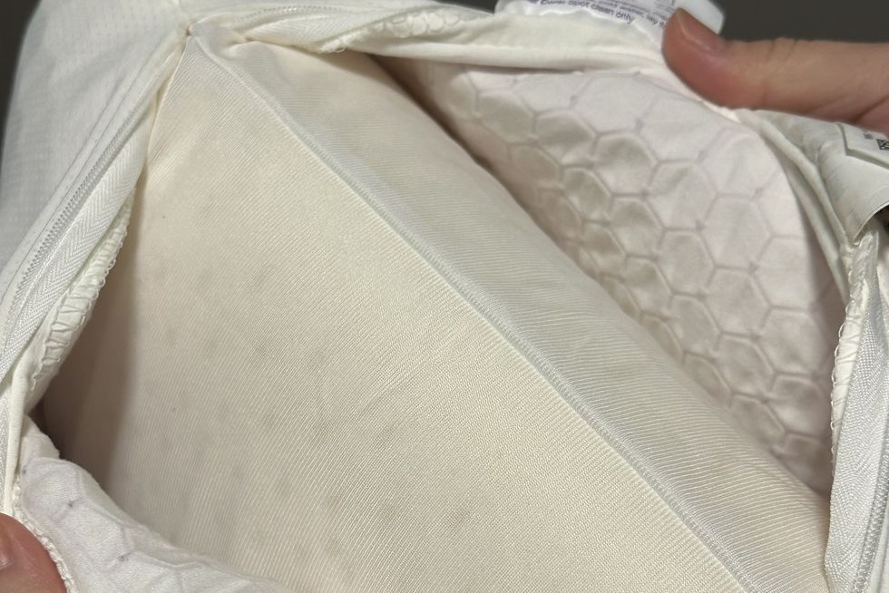 an unzipped purple harmony pillow showing the honeycomb grid and solid latex core