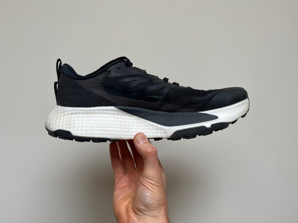 a person holding a shoe