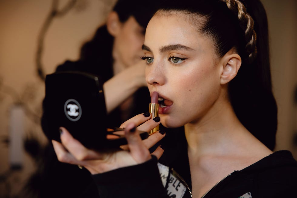 makeup application with a handheld mirror