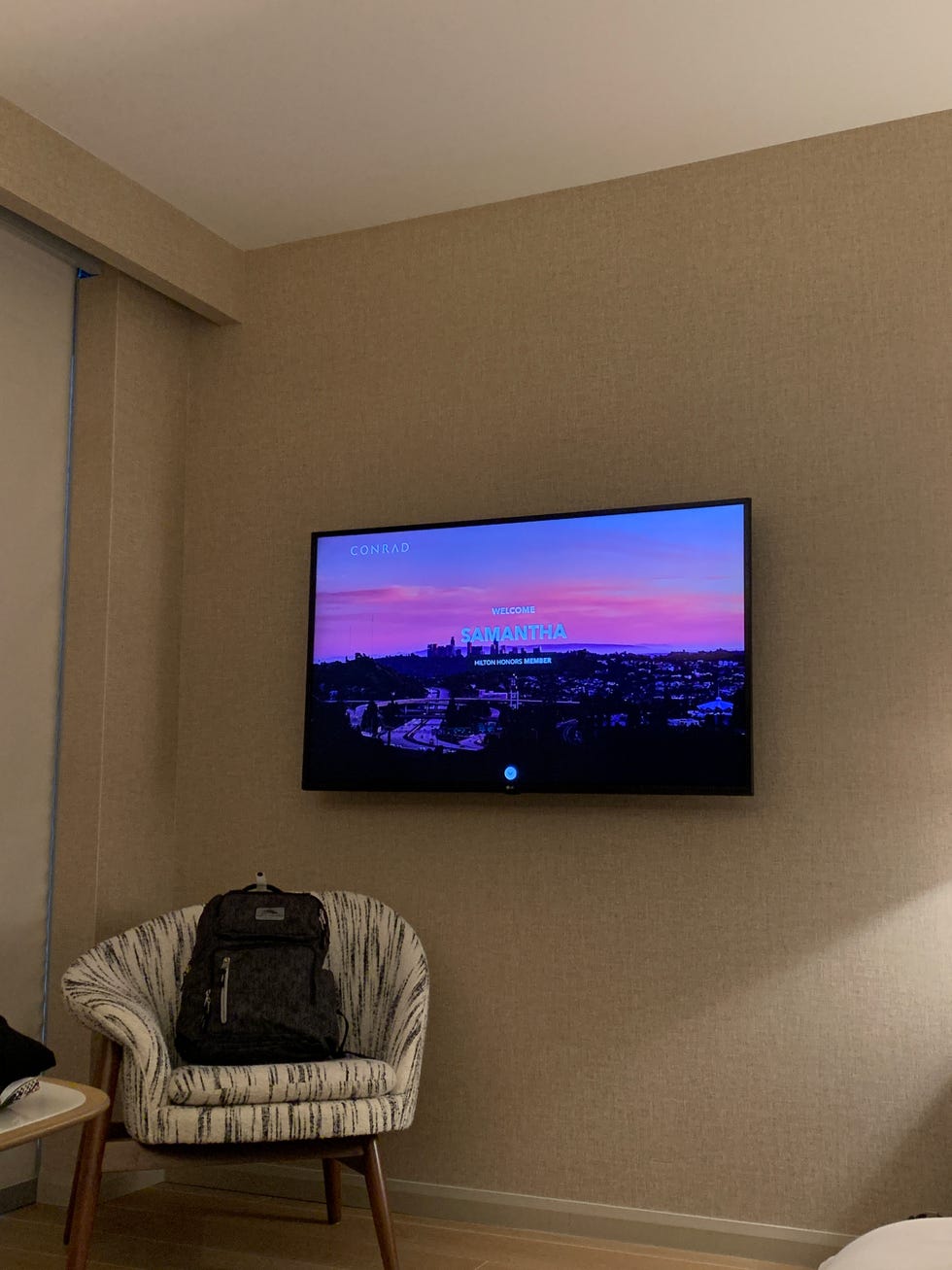 a television displaying a welcome message in a hotel room