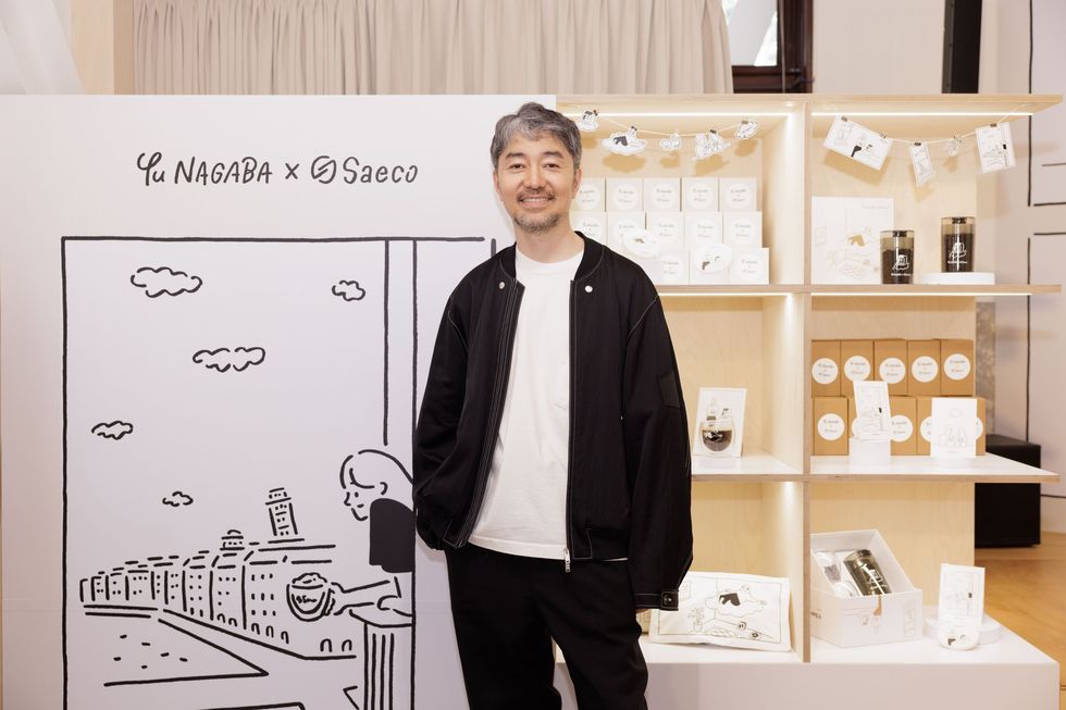 a man standing in front of a display of products