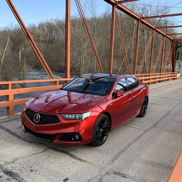 the 2020 acura tlx pmc edition out on country roads during an early michigan spring day