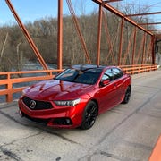 the 2020 acura tlx pmc edition out on country roads during an early michigan spring day