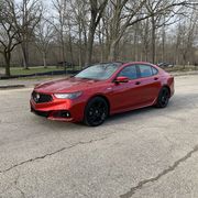 the 2020 acura tlx pmc edition out on country roads during an early michigan spring day