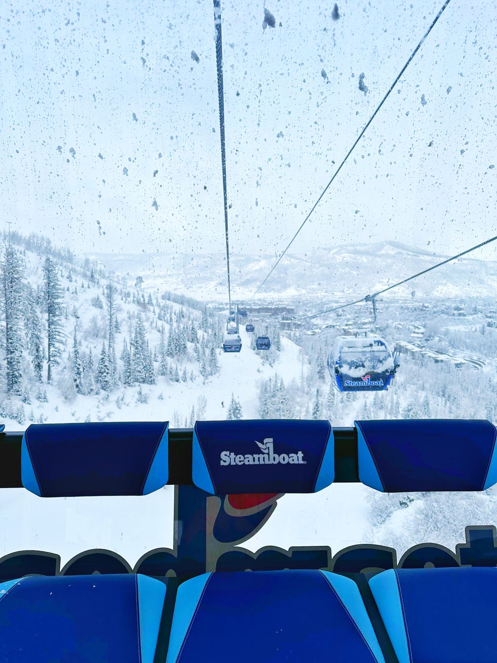 view from a ski lift with snowy landscape