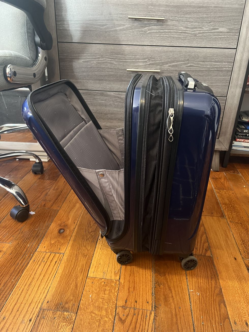 a couple of suitcases sit on a wood floor