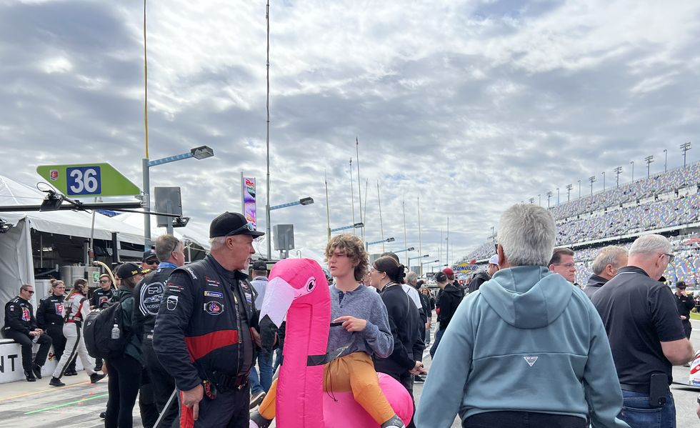 someone in an inflatable flamingo costume at the 24 hours of daytona