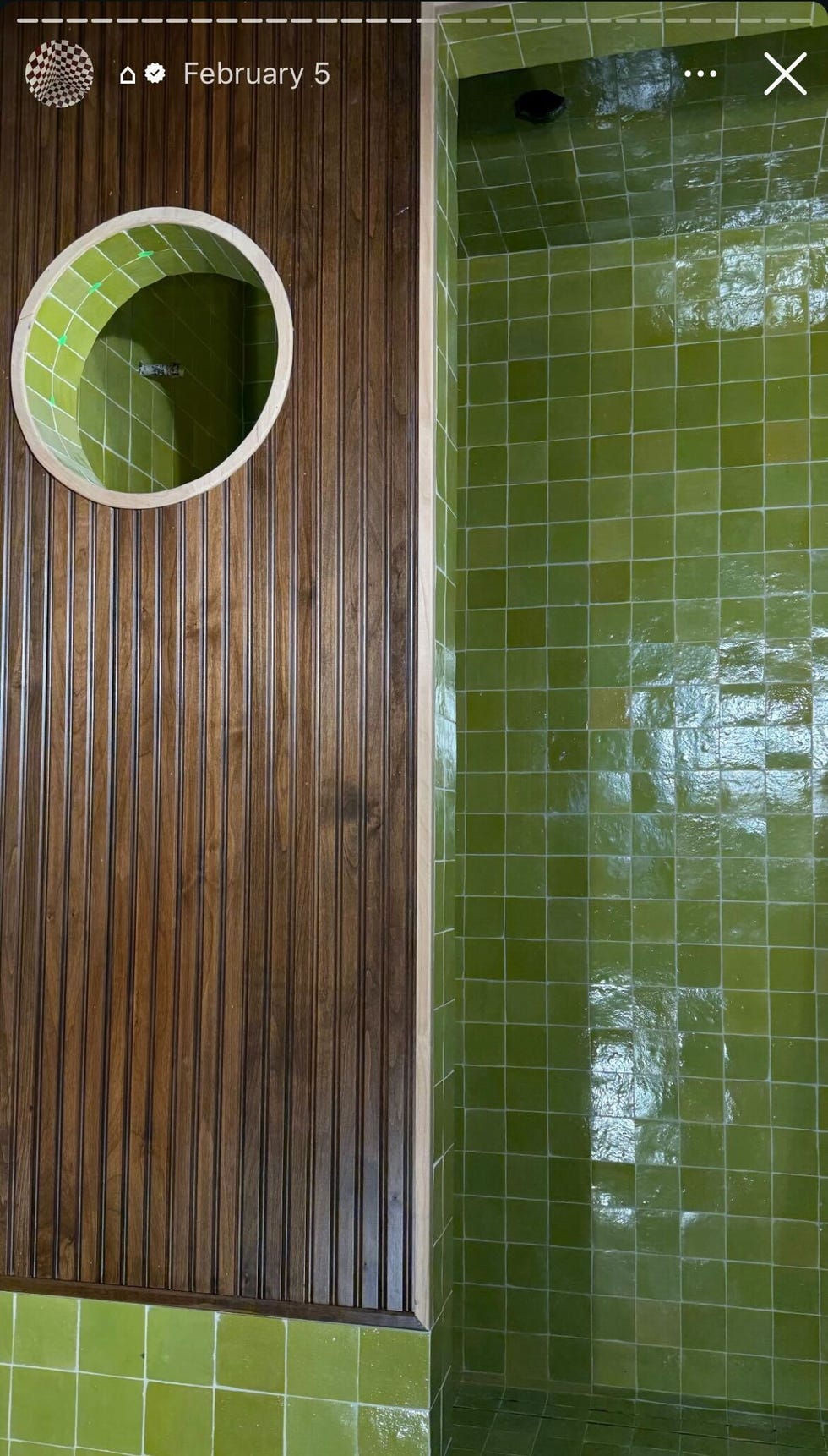 green tile bathroom with wood wall panel