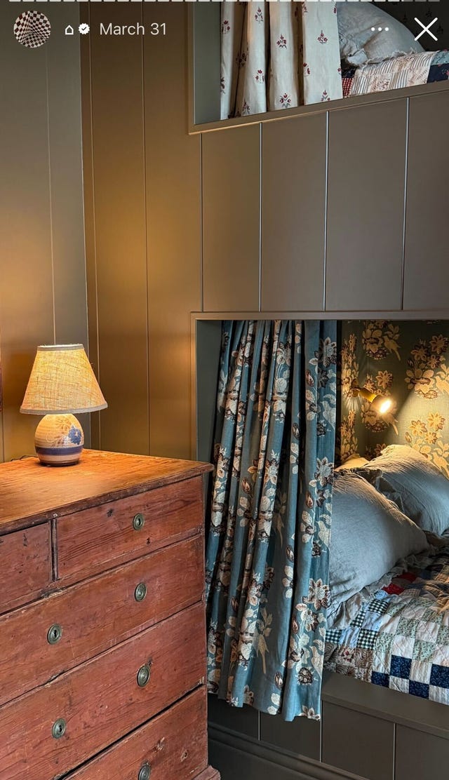 guest bedroom with built in bed bunks and a wooden dresser