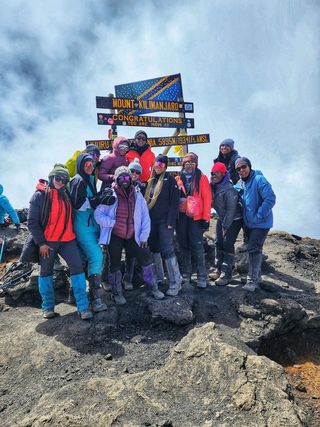 sistahs to the summit at uhuru peak, the summit of mount kilimanjaro