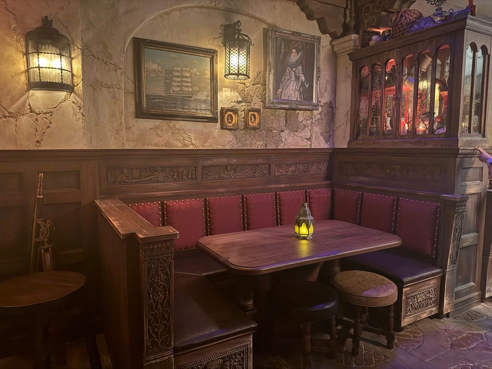 an empty pirate themed booth at the beak and barrel