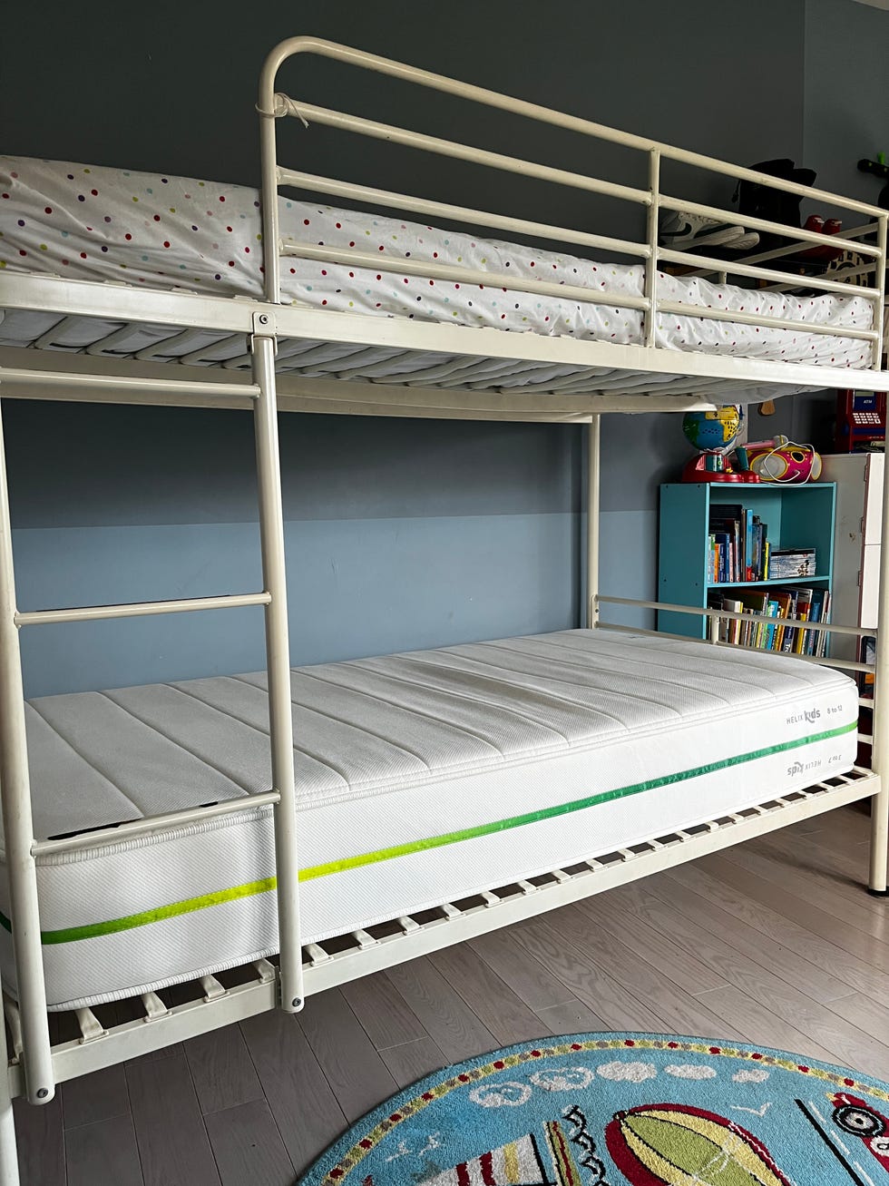 a helix kids mattress on a white bunk bed frame