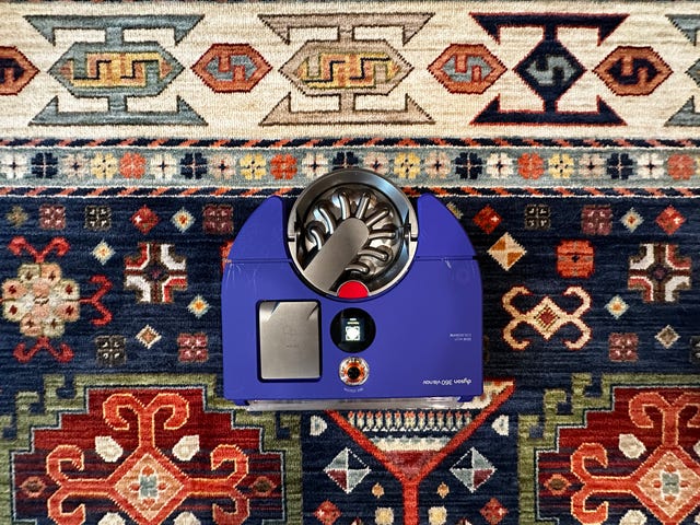 dyson 360 vis nav viewed from above on a colorful patterned rug
