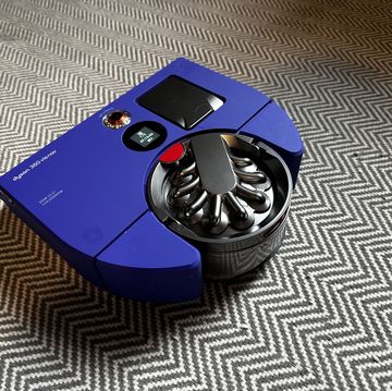 dyson 360 vis nav on a gray and white carpet