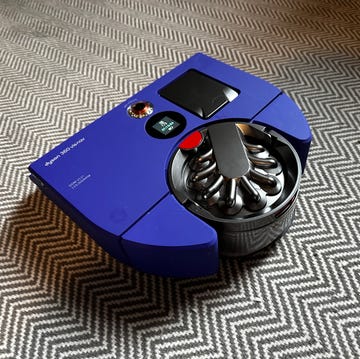 Dyson 360 Vis Nav on a gray and white carpet dyson 360 vis nav on a gray and white carpet
