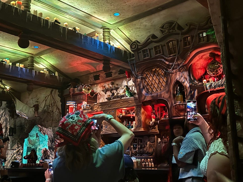 interior scene of a themed bar with patrons taking photos