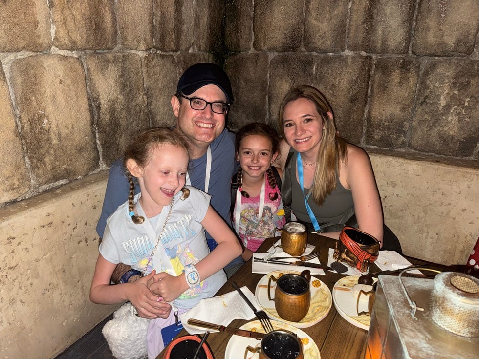 family seated at a dining table in a themed restaurant