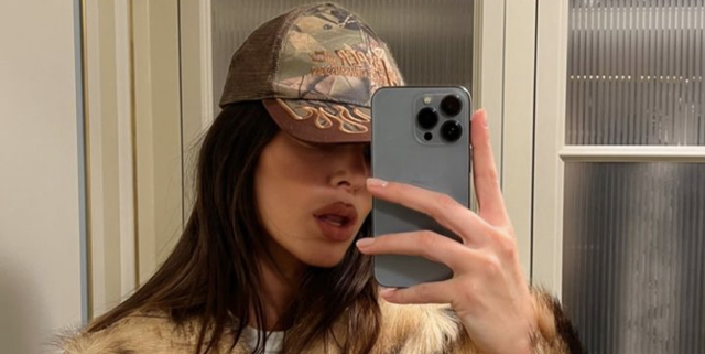 Kendall Jenner Pairs a Faux-Fur Coat with a Camouflage Trucker Hat