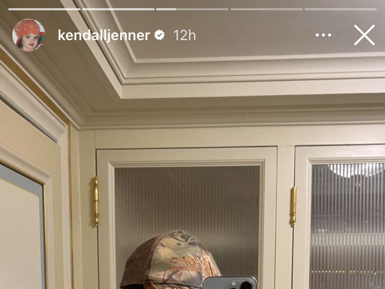 Faux-Fur Coat Pairs a with Kendall Camouflage Trucker Hat Jenner a