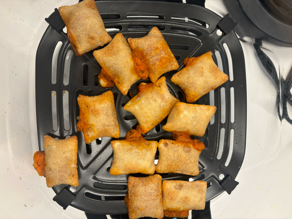 cooked snack in a black air fryer basket