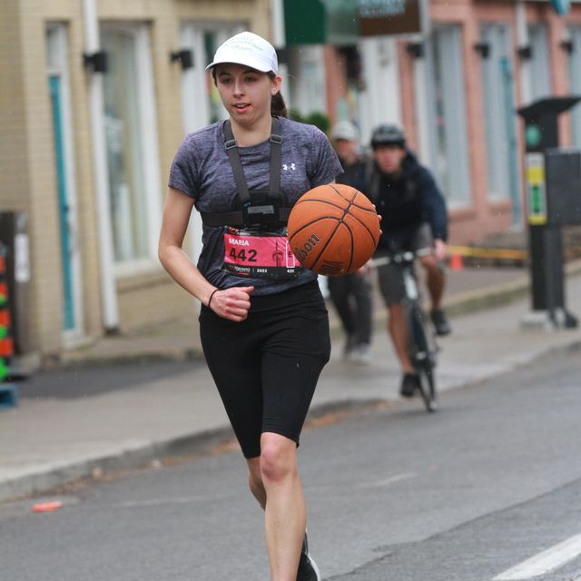 a person running with a basketball