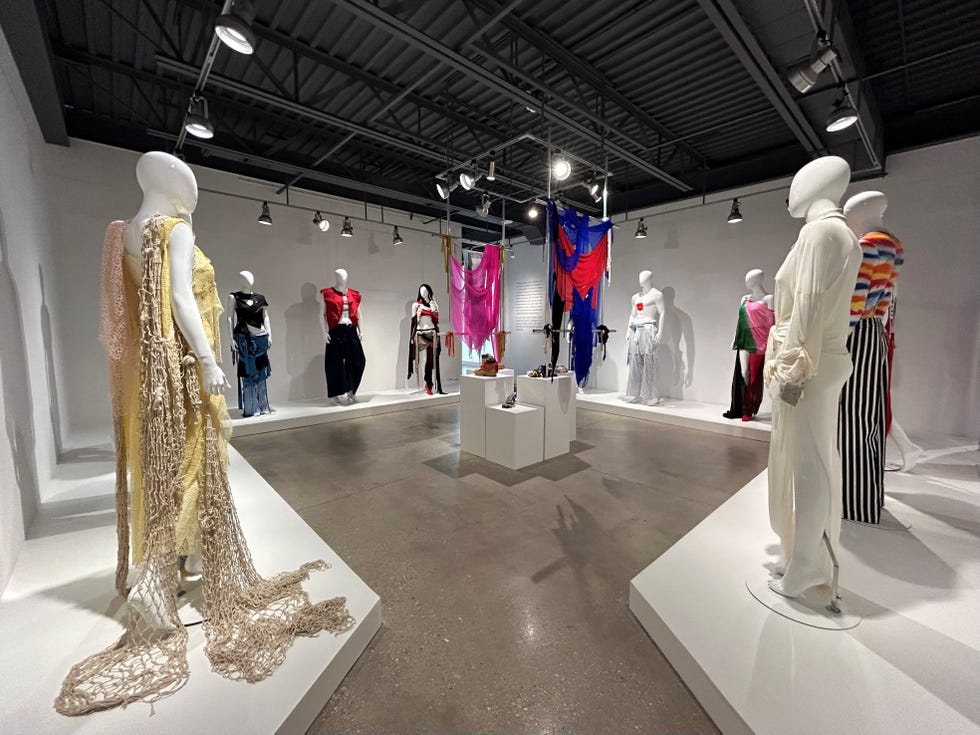 fashion exhibition featuring diverse clothing designs on mannequins