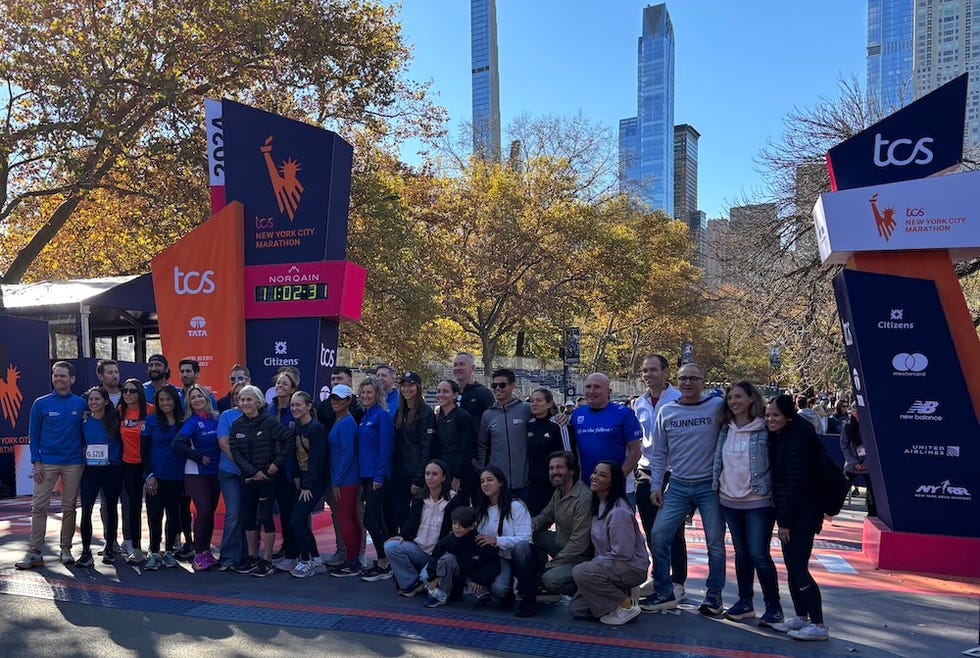 group of runners posing at the new york city marathon event