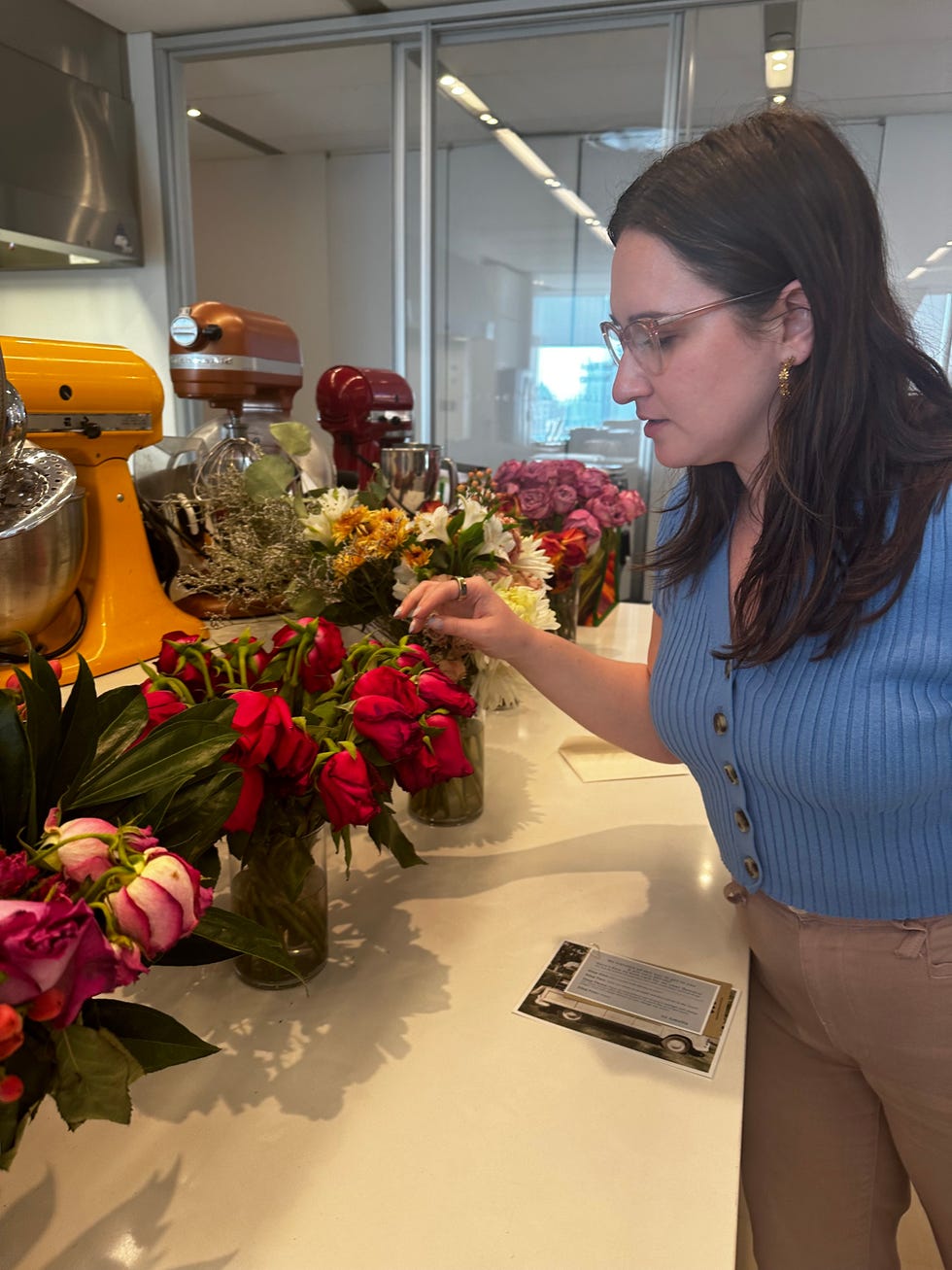 woman inspecting flowers after a week of testing