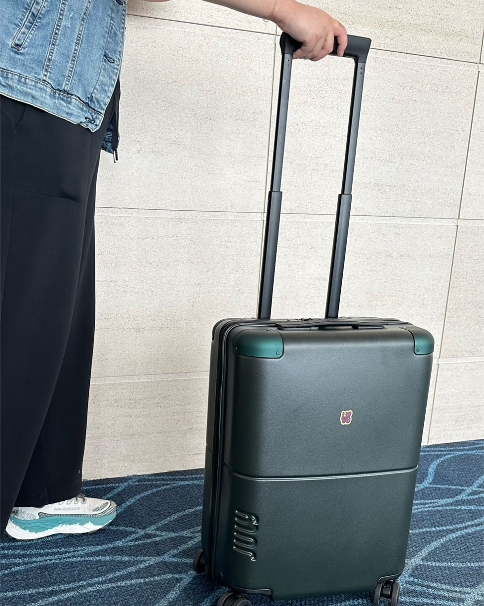 a person holding a suitcase