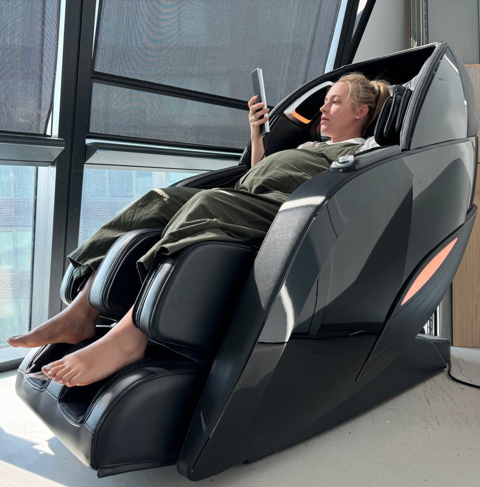relaxation chair with user distracted by a mobile device