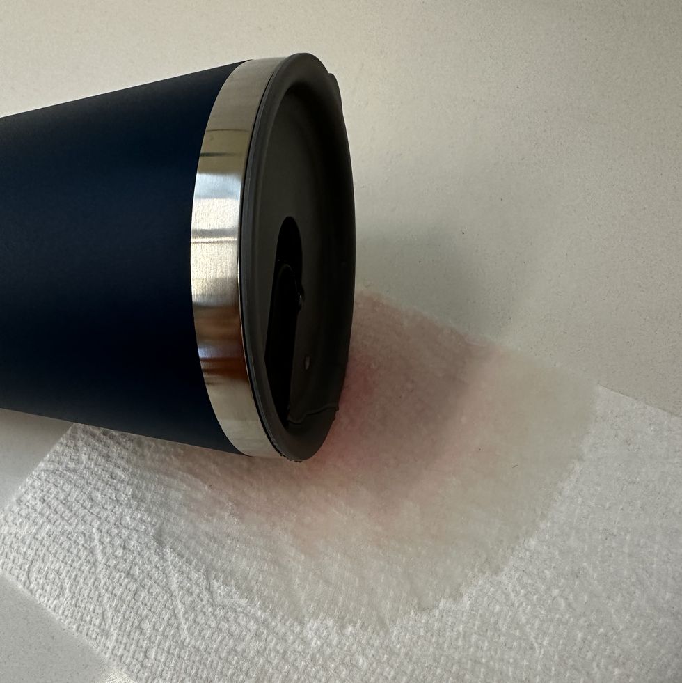 a tumbler leaking on a paper towel