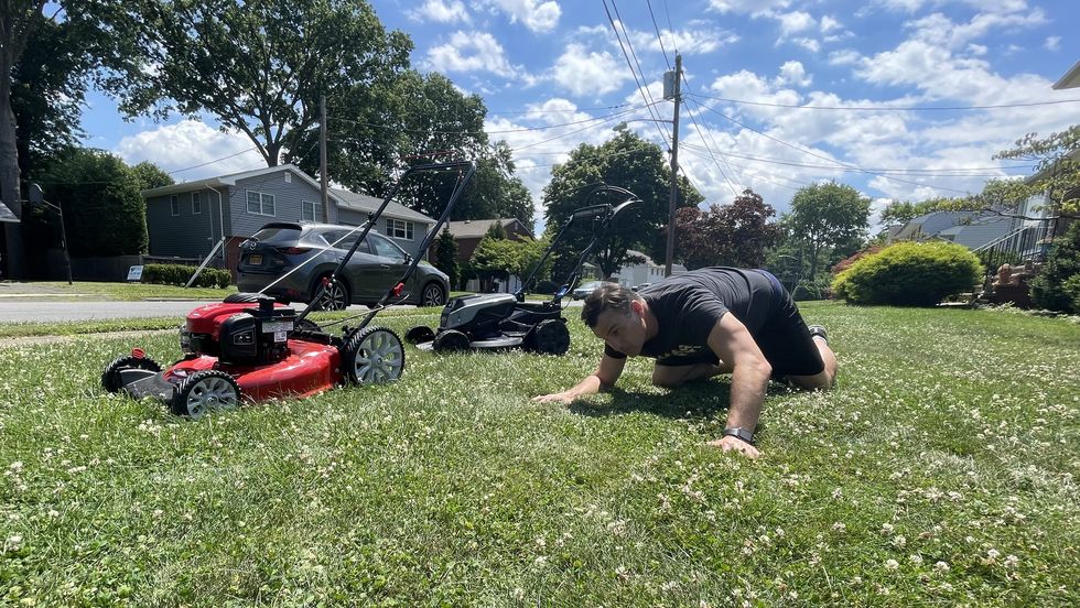 a good housekeeping experts checks for evenness of cutting during lawn mower testing