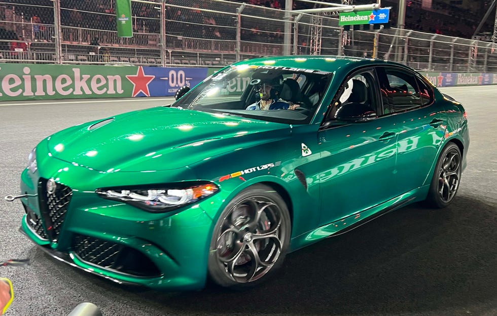 a green car on a race track