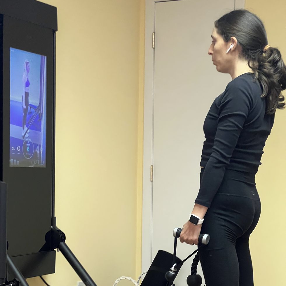 tester testing out mirror workouts for good housekeeping's best workout fitness mirrors