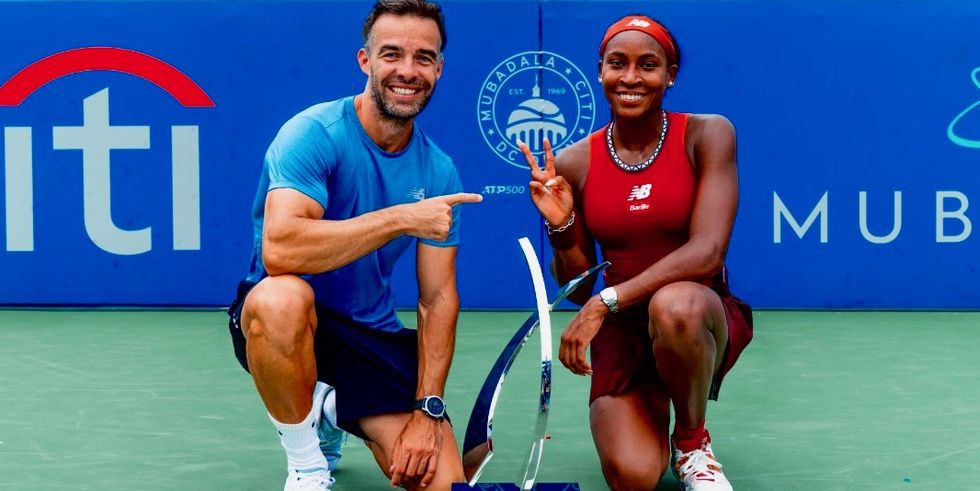 a man and woman holding tennis rackets