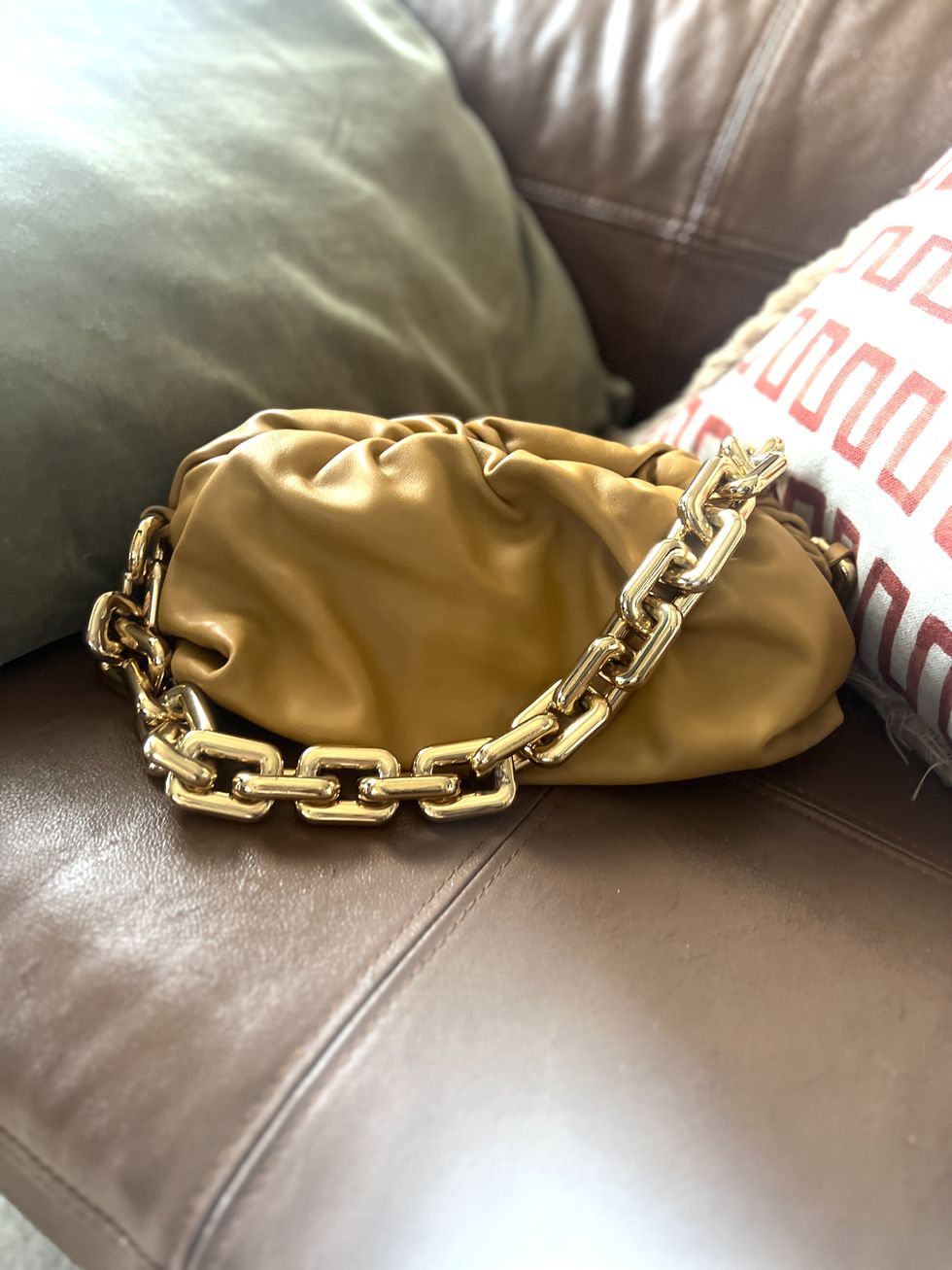 a gold chain on a couch