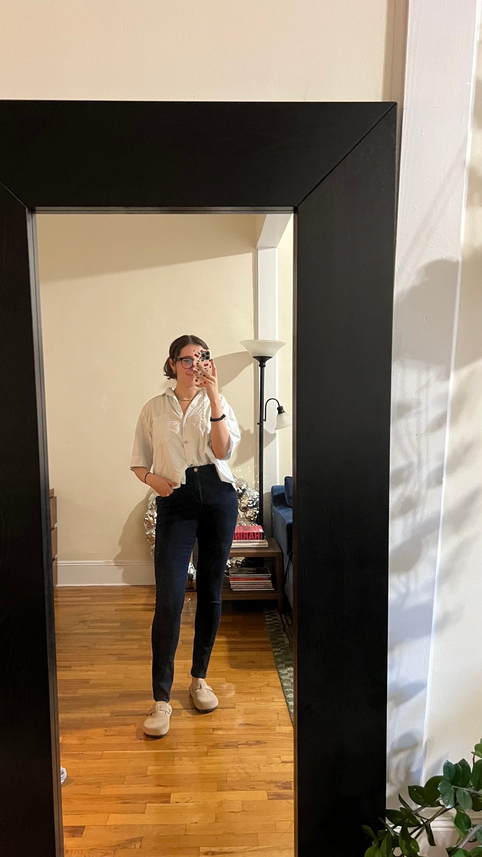 a tester wearing black universal standard skinny jeans, good housekeeping's best jeans for women