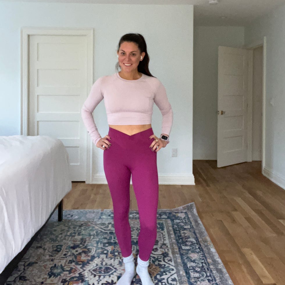 person standing in a room wearing workout attire