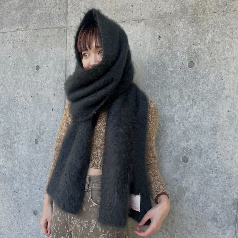 a woman wearing a black scarf