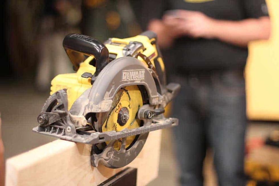 dewalt circular saw positioned on a wooden plank